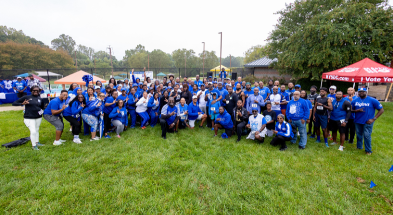 Community gathering at a past Stronger Together 5K